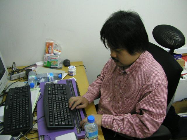 Photo of Max working at desk